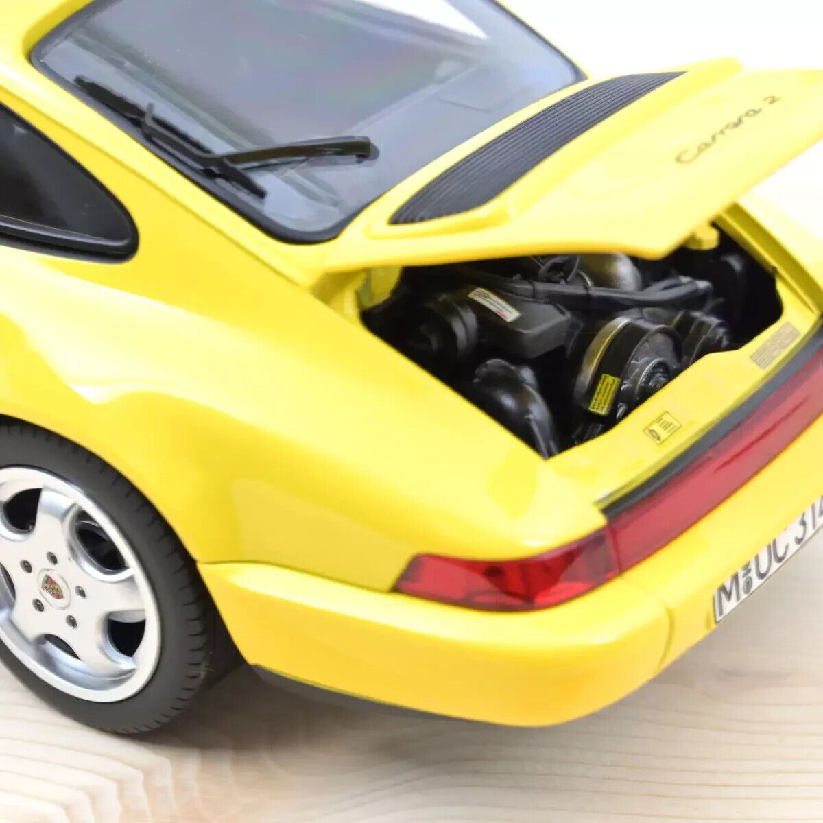 1/18 scale 1991 Porsche 964 Carrera 2 Yellow diecast model car by NOREV