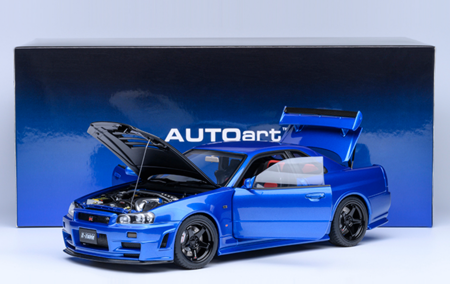 NISSAN NISMO (R34) GT-R-Z-TUNE - BAYSIDE BLUE W/ CARBON HOOD - AUTOART 1/18