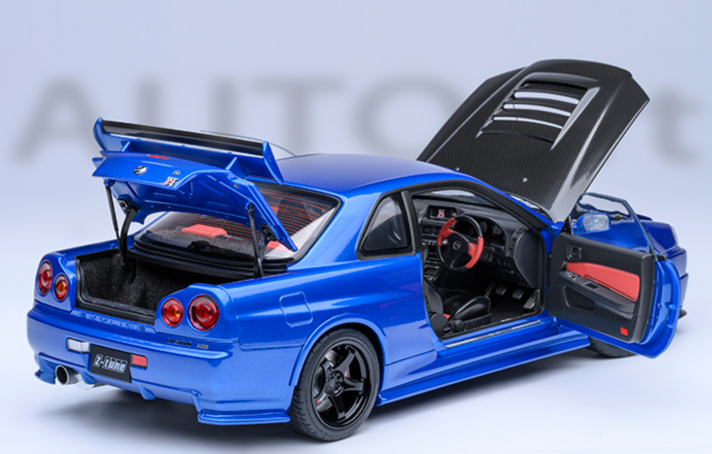 NISSAN NISMO (R34) GT-R-Z-TUNE - BAYSIDE BLUE W/ CARBON HOOD - AUTOART 1/18