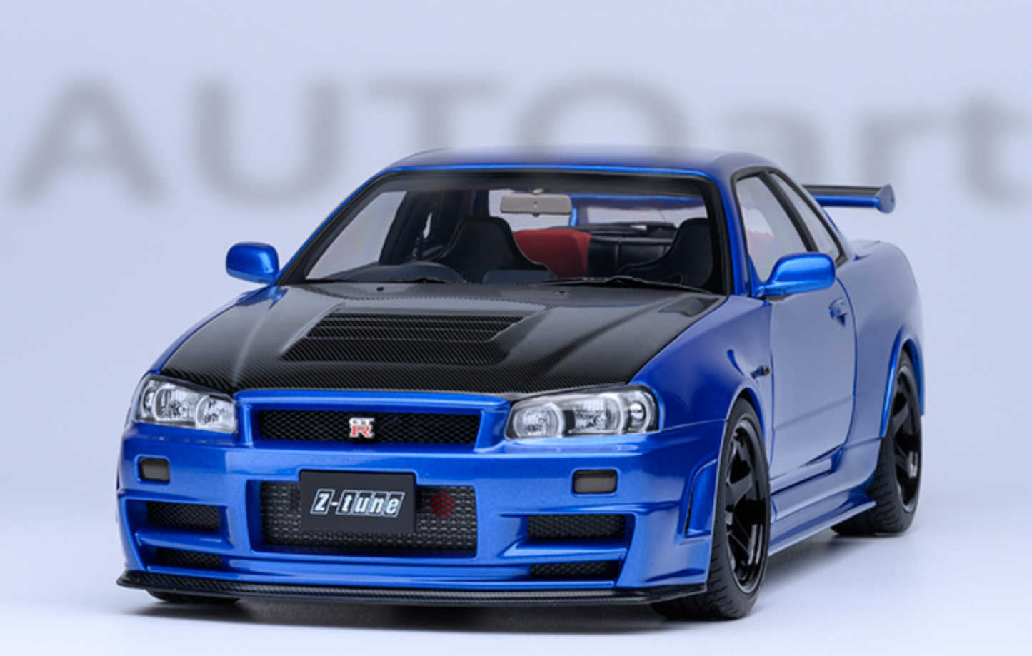 NISSAN NISMO (R34) GT-R-Z-TUNE - BAYSIDE BLUE W/ CARBON HOOD - AUTOART 1/18