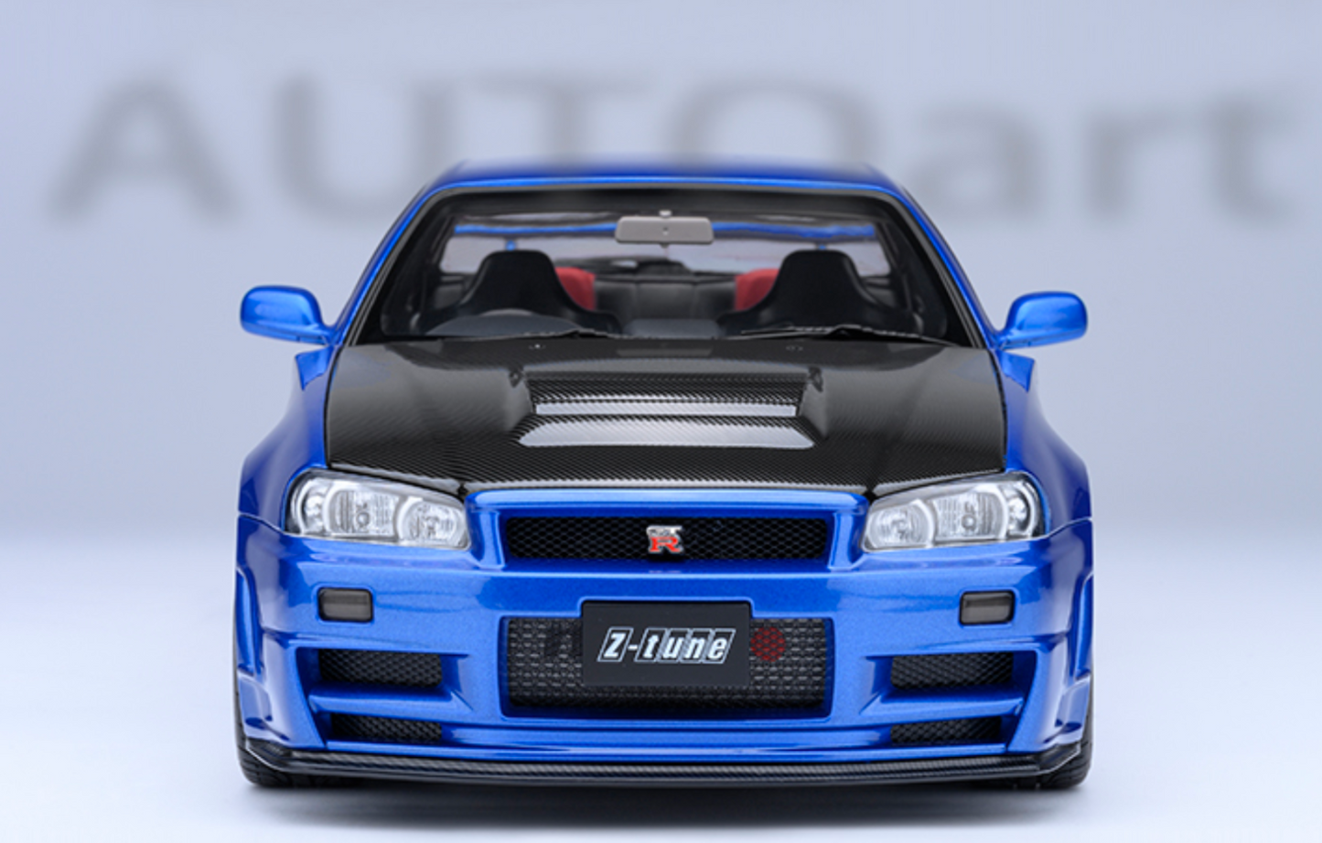 NISSAN NISMO (R34) GT-R-Z-TUNE - BAYSIDE BLUE W/ CARBON HOOD - AUTOART 1/18